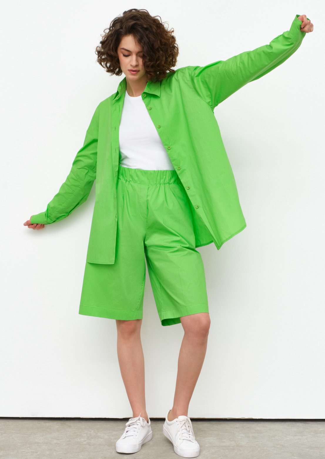 Light green colour suit with shirt and elongated shorts 
