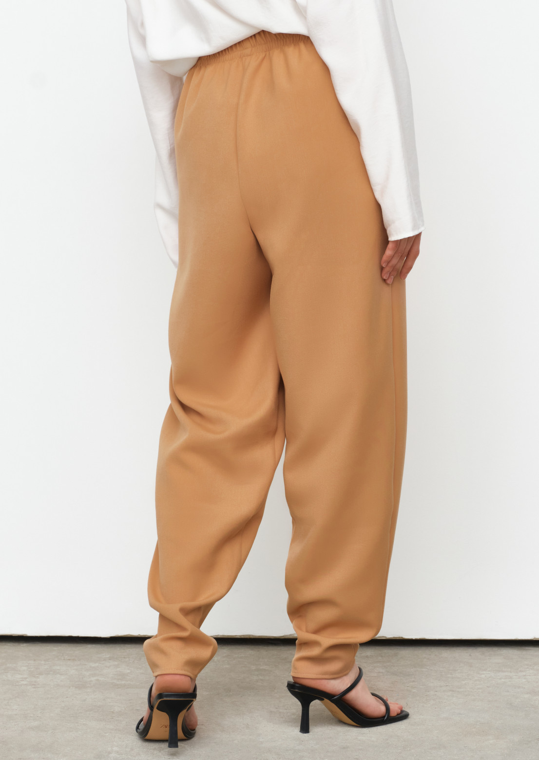 Beige colour tight fabric trousers