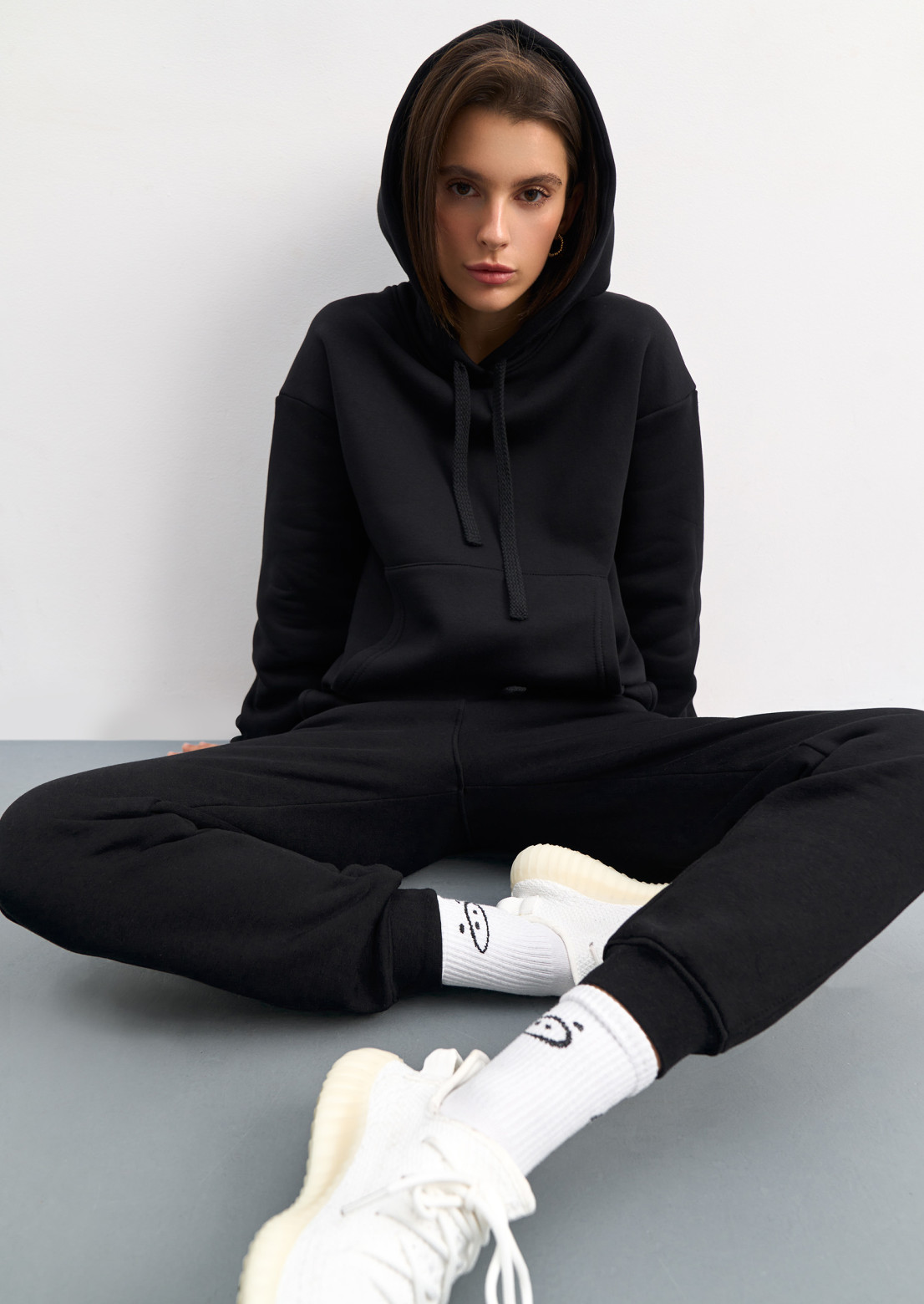 Black colour three-thread insulated suit with a hood 