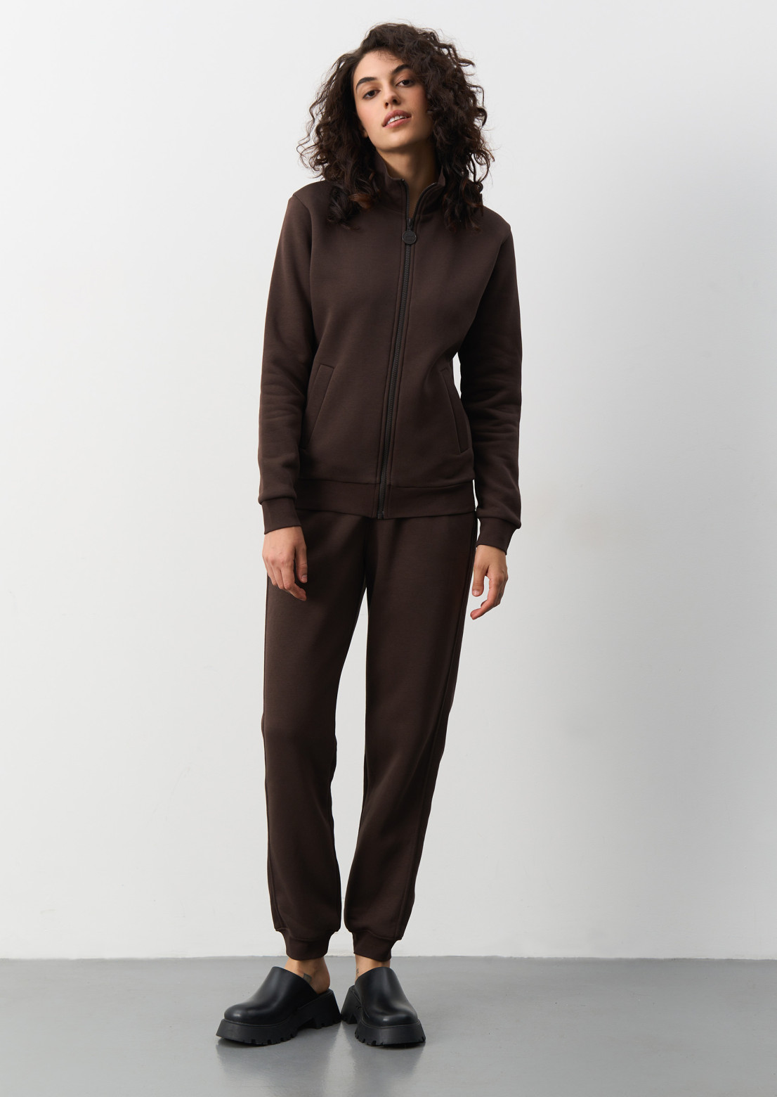 Dark brown color three-thread insulated suit with stand and with zip 