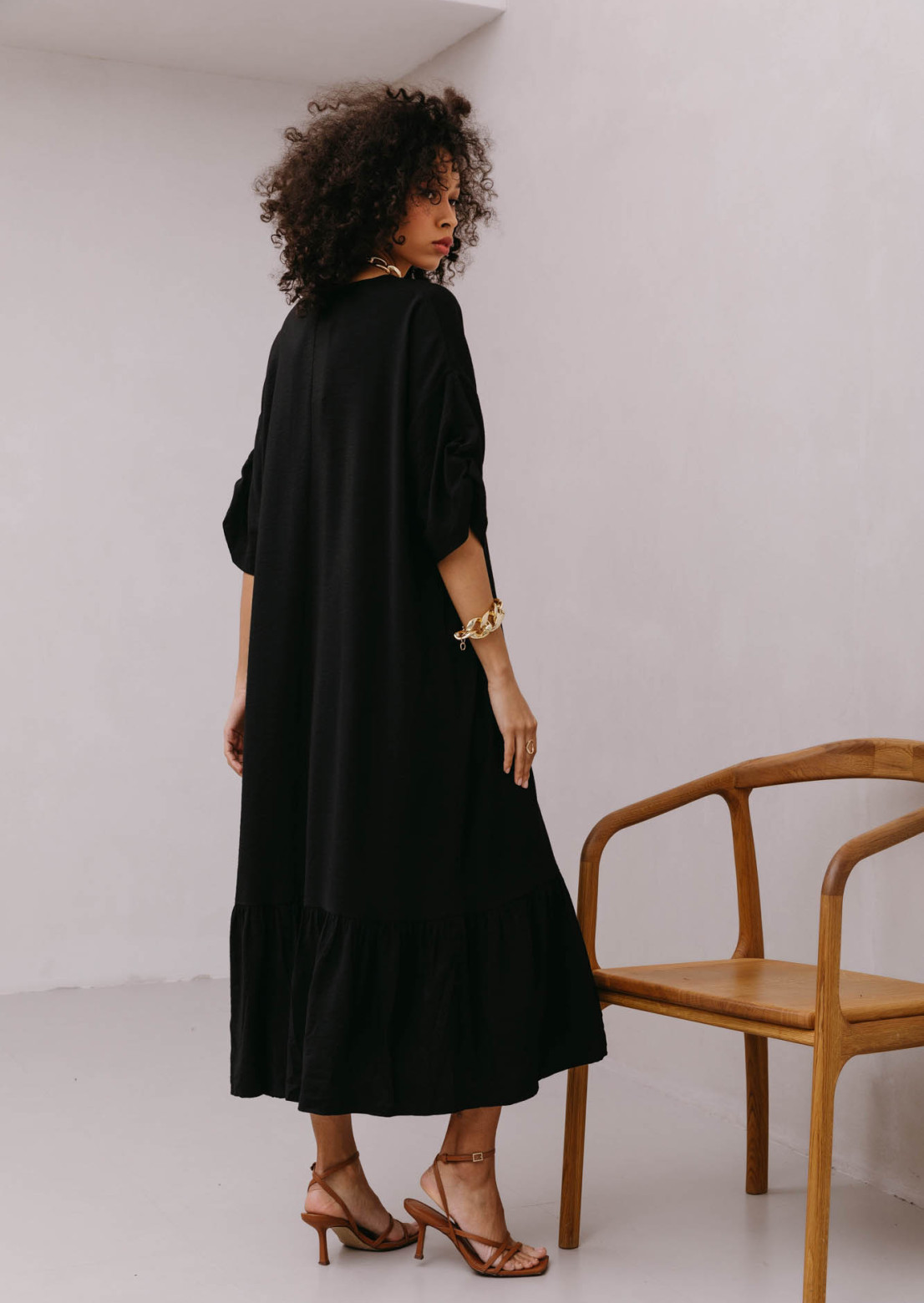 Black color voluminous elongated dress 