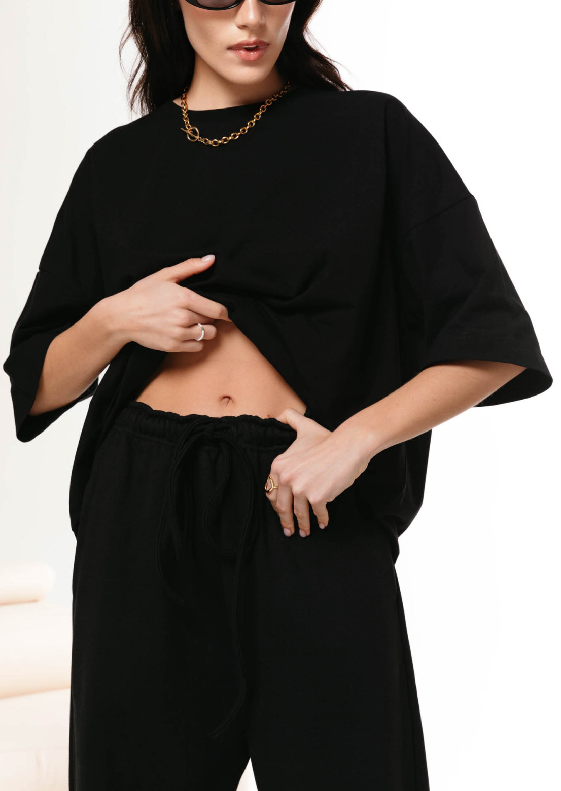 Black oversize trousers made of dense three-thread