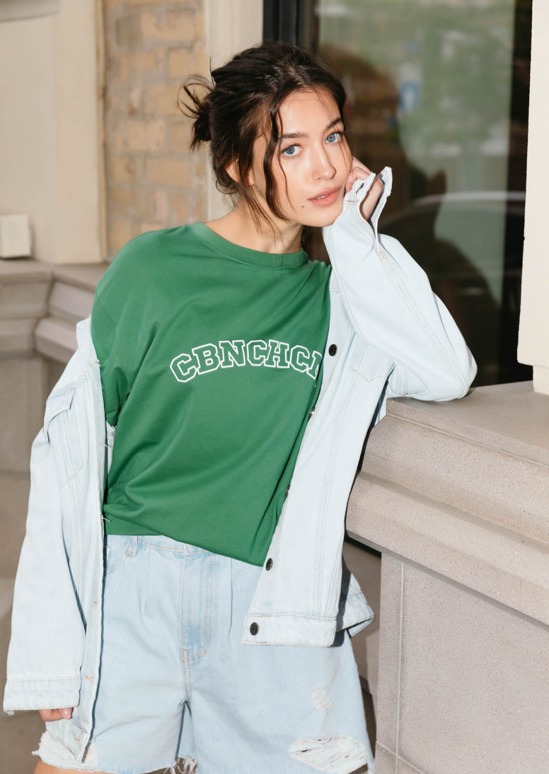 Green color T-shirt with a print "CBNCHCM"