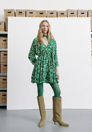Green chiffon dress in a flower pattern with a neck detail