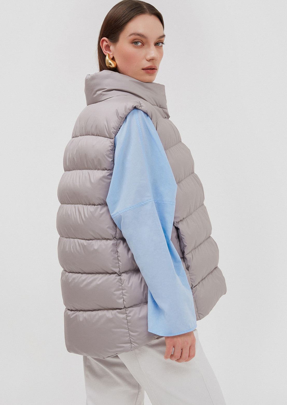 Grey color puffy vest with buttons