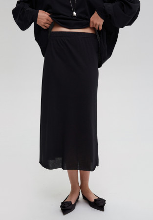 Black jersey skirt with raw edge