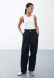 Milk color cotton pleated trousers