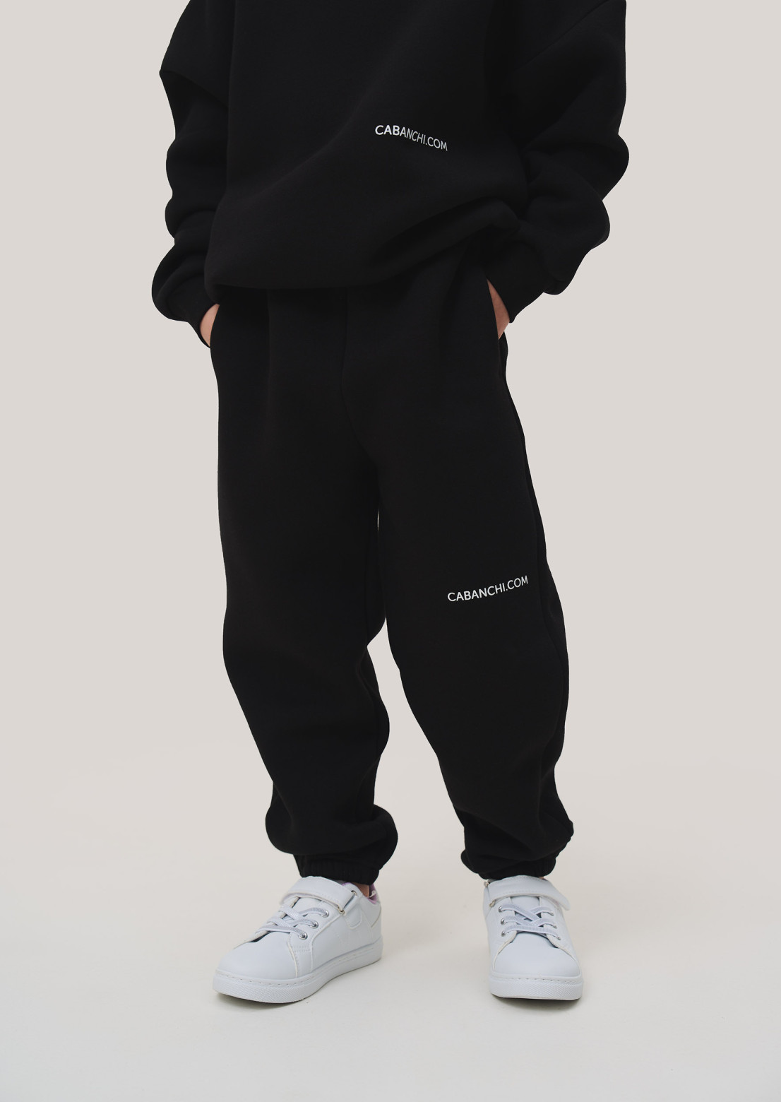 Black color kids three-thread insulated oversize trousers with print "Cabanchi.com"